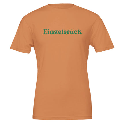 Unisex T-Shirt gebranntes Orange aus hochwertiger Baumwolle mit grünem Schriftzug „Einzelstück“, nachhaltig, spirituell,.