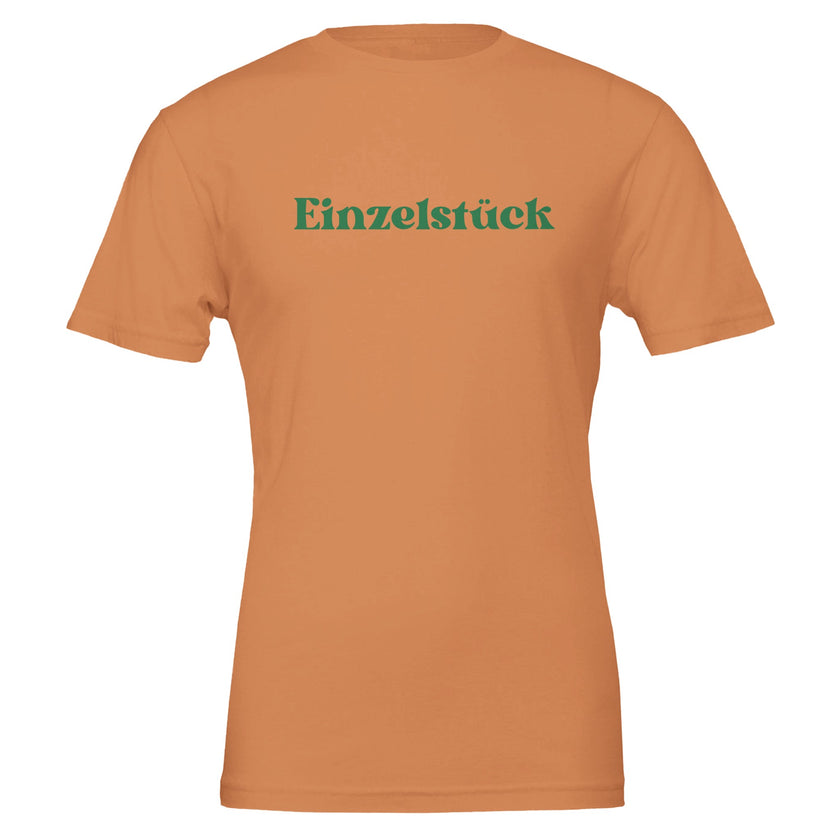 Unisex T-Shirt gebranntes Orange aus hochwertiger Baumwolle mit grünem Schriftzug „Einzelstück“, nachhaltig, spirituell,.