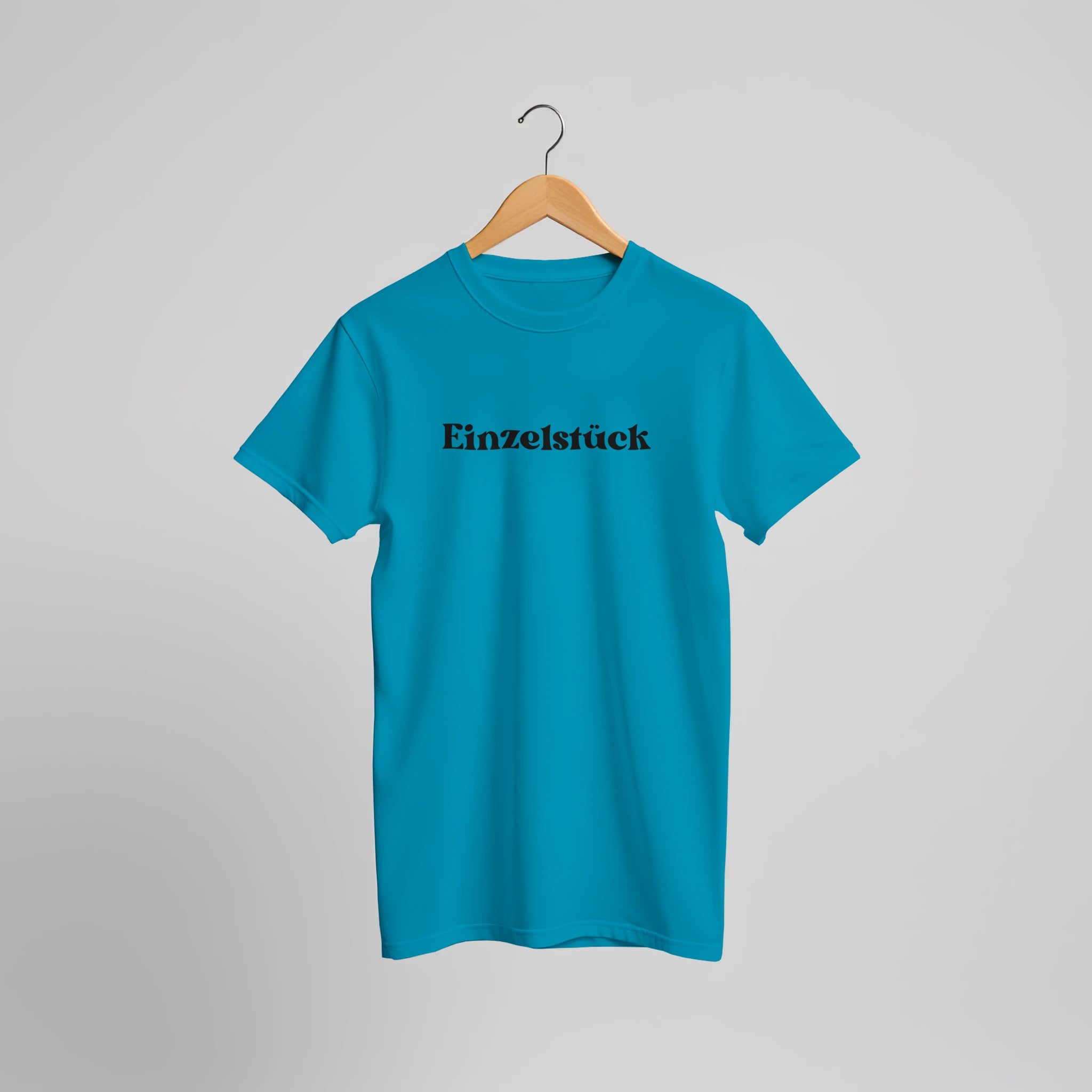 Unisex-T-Shirt in Aqua aus nachhaltiger Baumwolle mit spirituellem „Einzelstück“-Print in Schwarz, hochwertig bedruckt,.